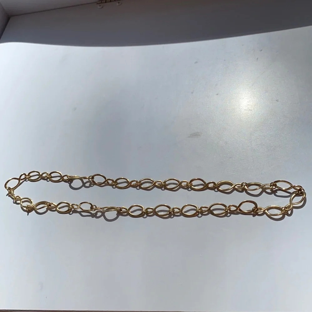 Two gold look necklaces chains loops spirals